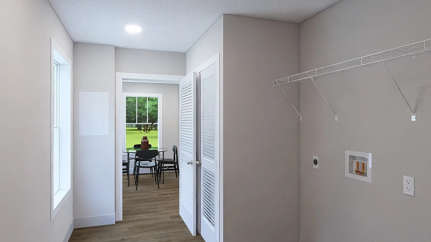 The HERE COMES THE SUN Utility Room. This Manufactured Mobile Home features 3 bedrooms and 2 baths.