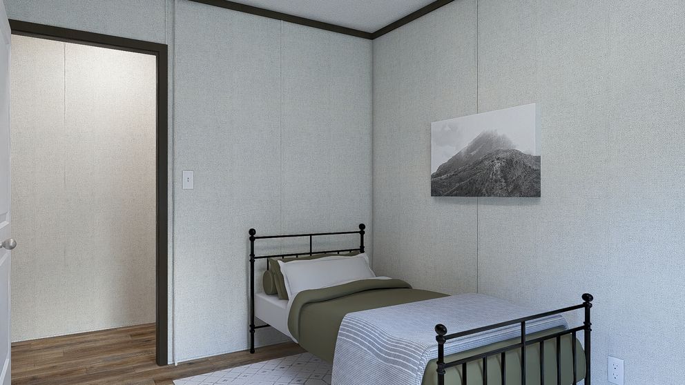 The DYNAMIC Guest Bedroom. This Manufactured Mobile Home features 3 bedrooms and 2 baths.