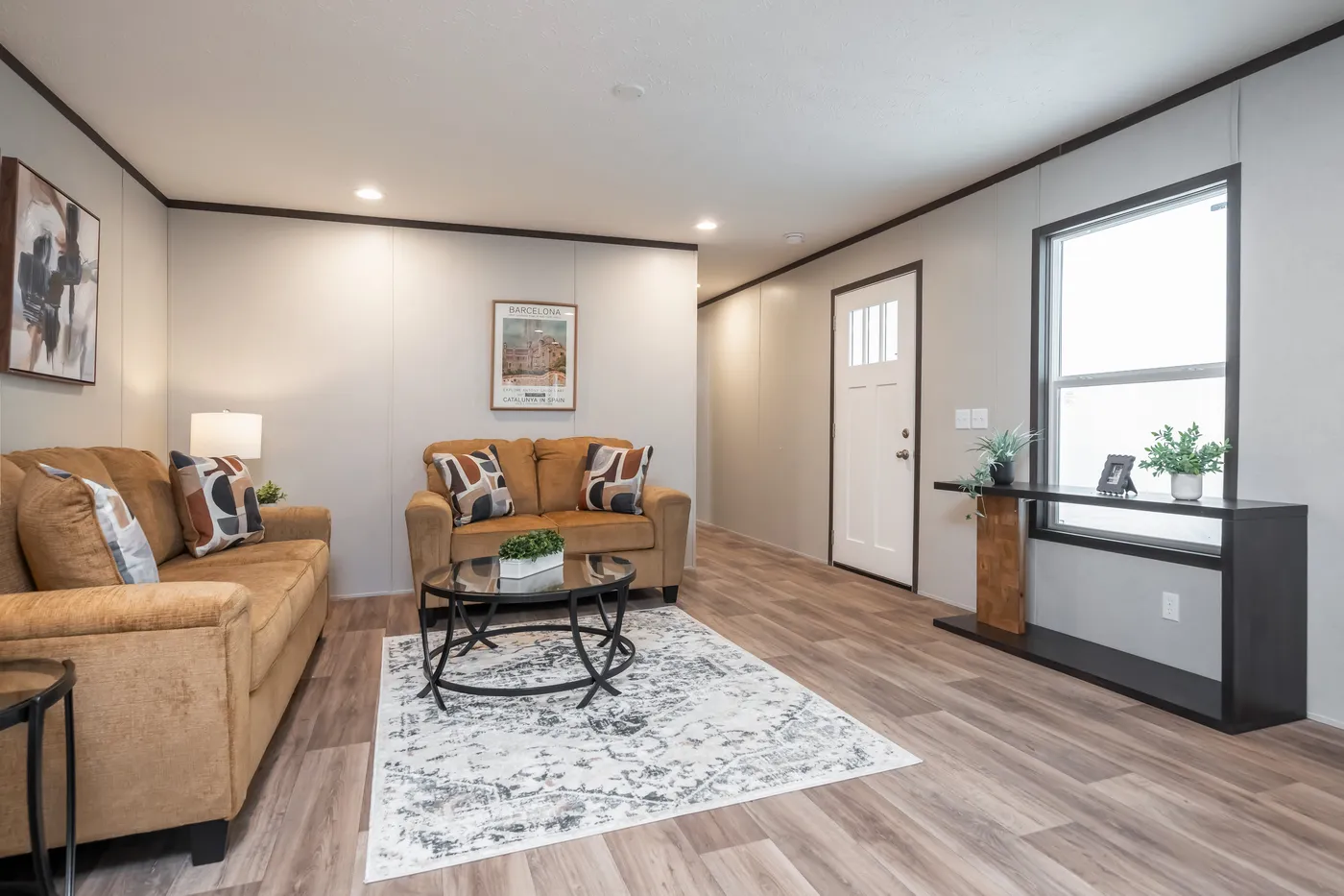 The ESSENCE Living Room. This Manufactured Mobile Home features 3 bedrooms and 2 baths.