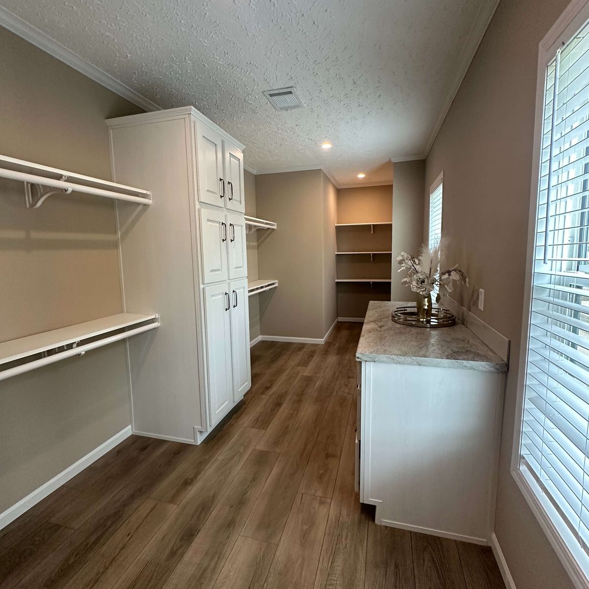 The THE HEXAGON Storage. This Manufactured Mobile Home features 4 bedrooms and 3 baths.