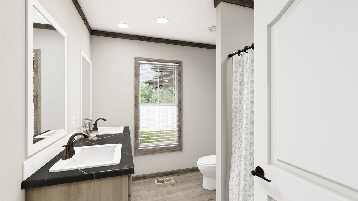 The THE MADISON Guest Bathroom. This Manufactured Mobile Home features 3 bedrooms and 2 baths.