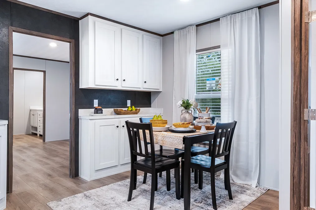 The SELECT 16723F Dining Room. This Manufactured Mobile Home features 3 bedrooms and 2 baths.