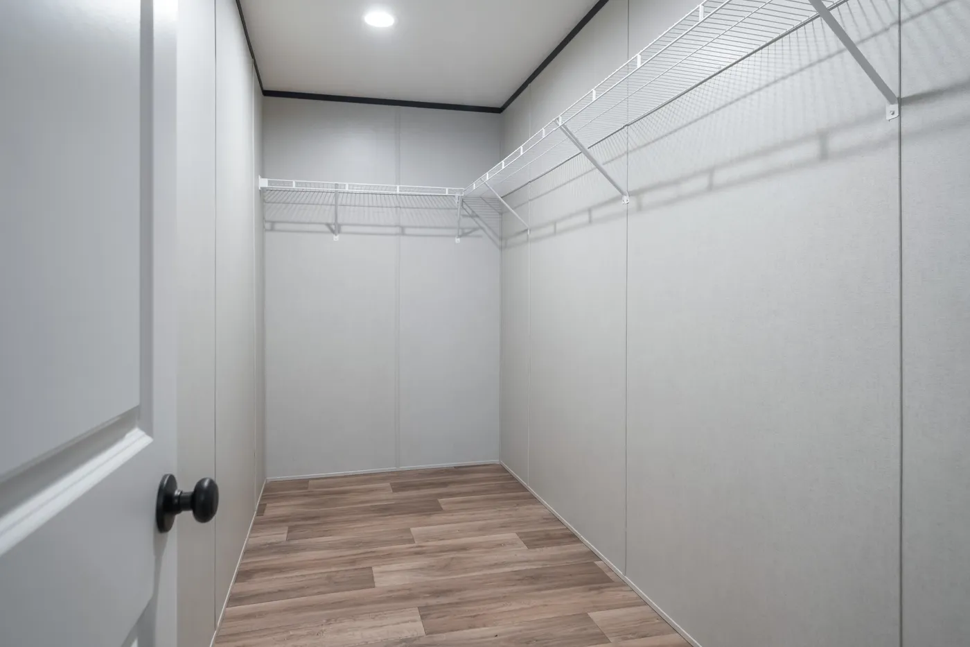 The ABSOLUTE VALUE Primary Bedroom. This Manufactured Mobile Home features 4 bedrooms and 2 baths.