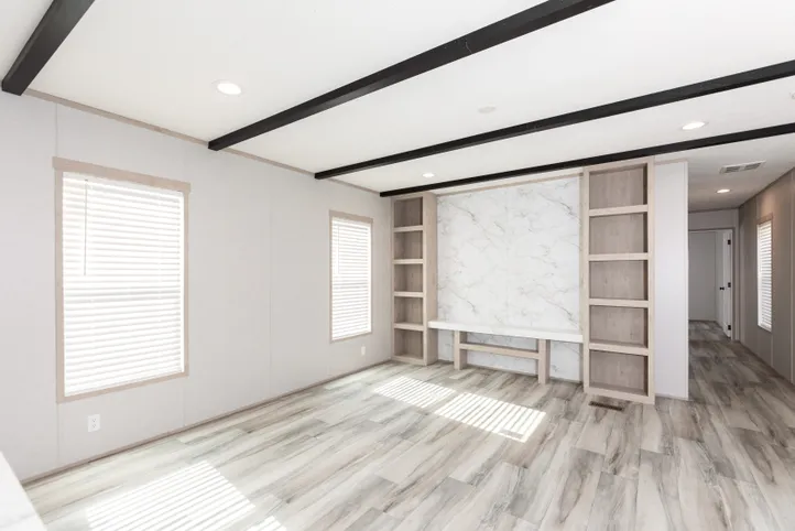 The THE ANNIVERSARY ISLANDER Living Room. This Manufactured Mobile Home features 3 bedrooms and 2 baths.