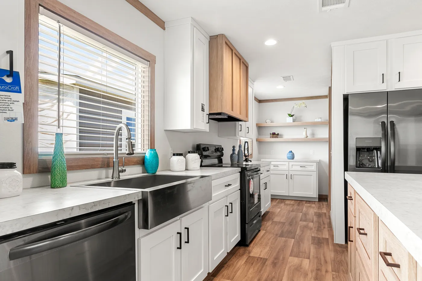 The LIZZIE Kitchen. This Manufactured Mobile Home features 3 bedrooms and 2 baths.