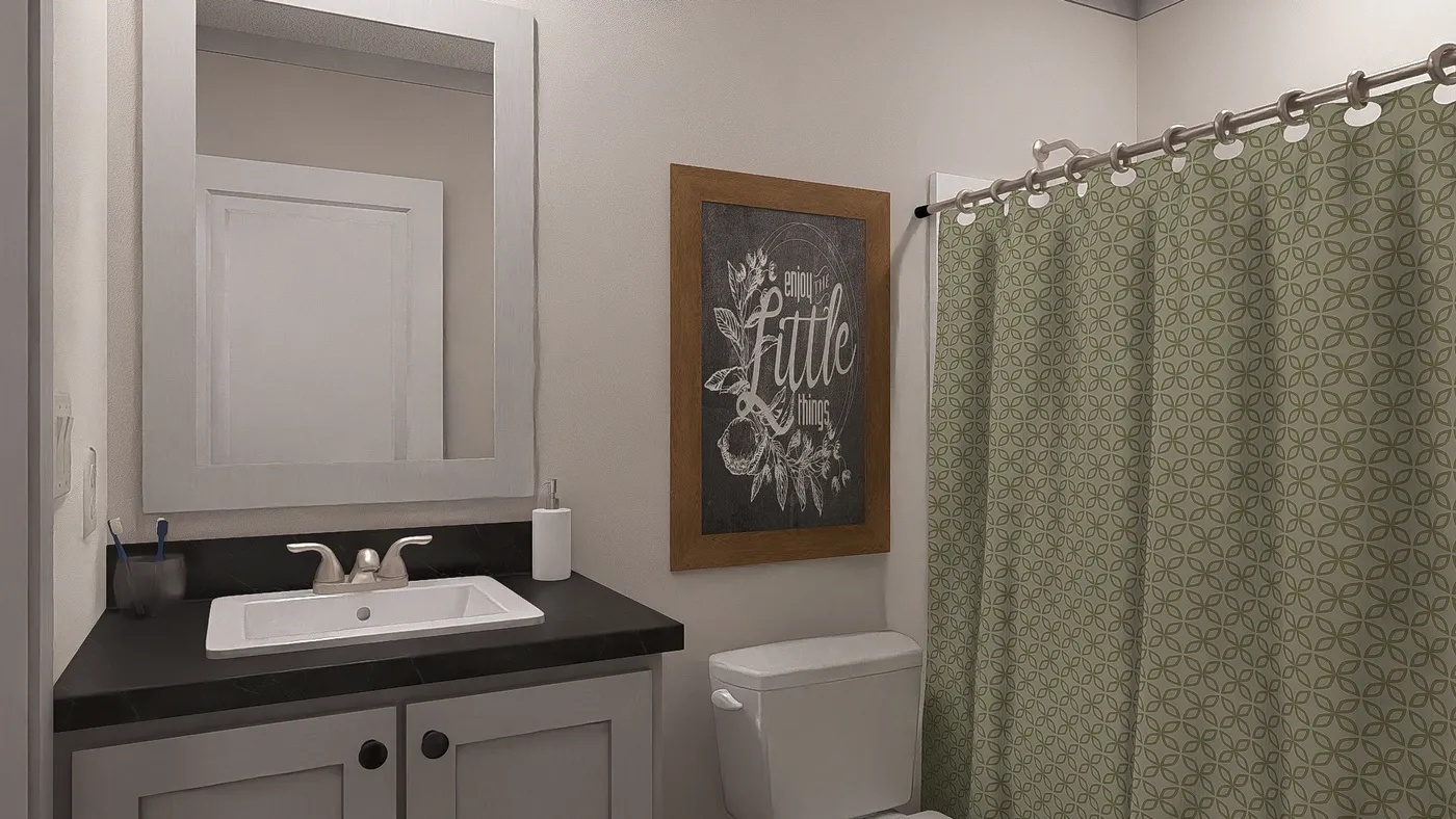 The STAYIN' ALIVE Guest Bathroom. This Manufactured Mobile Home features 3 bedrooms and 2 baths.