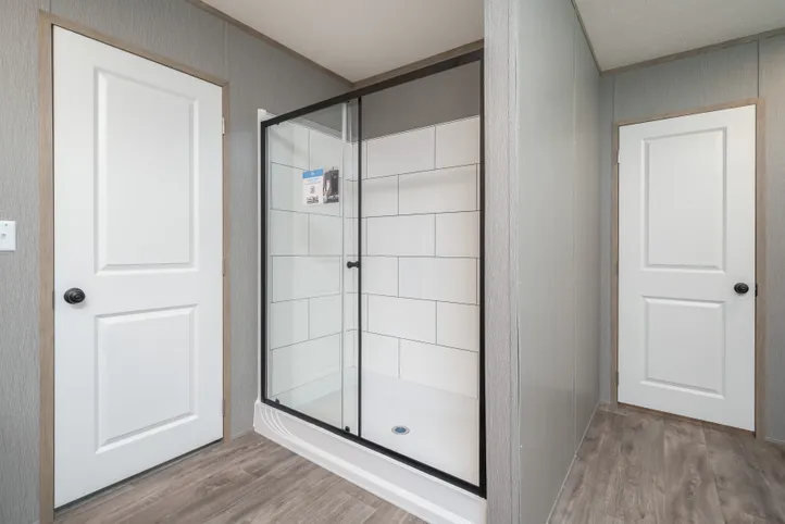 The BLUEBONNET BREEZE Primary Bathroom. This Manufactured Mobile Home features 3 bedrooms and 2 baths.