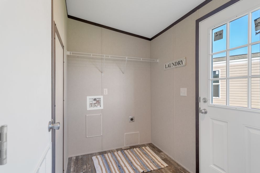The GARNET Utility Room. This Manufactured Mobile Home features 3 bedrooms and 2 baths.