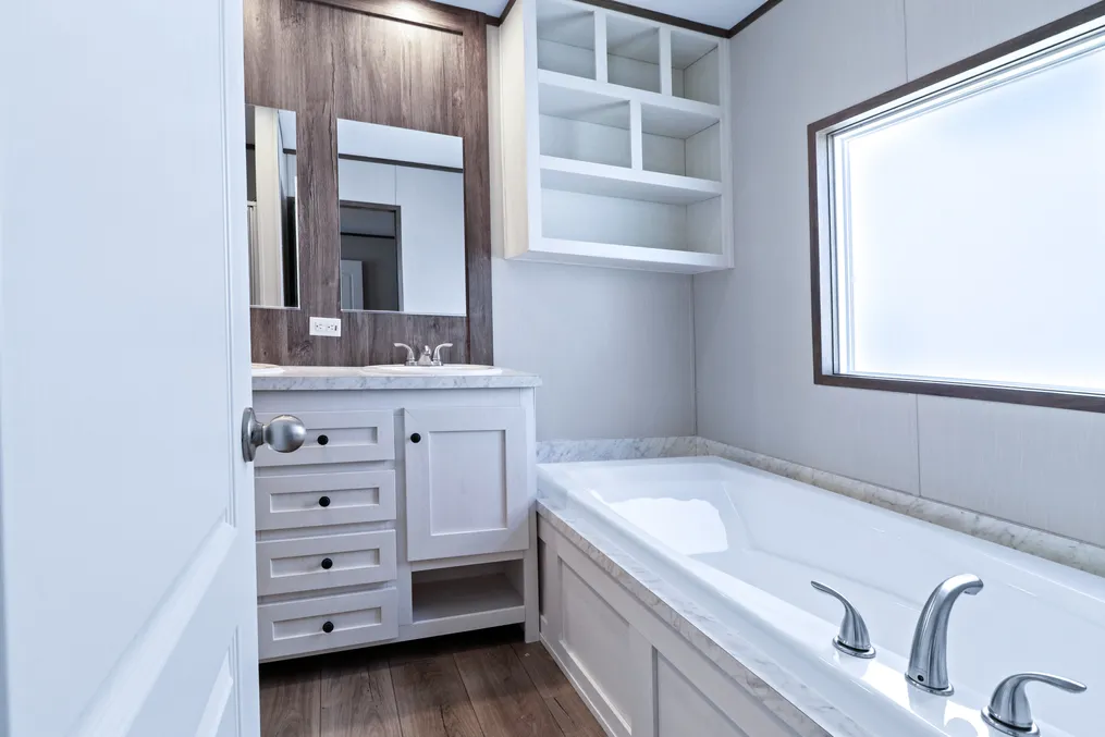 The ANNIVERSARY 16763S Primary Bathroom. This Manufactured Mobile Home features 3 bedrooms and 2 baths.