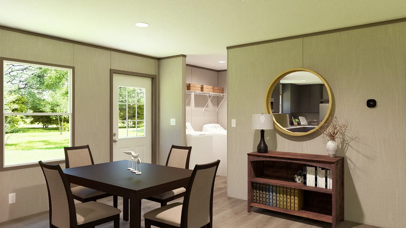 The LEGEND 28X56 4 BR Dining Room. This Manufactured Mobile Home features 4 bedrooms and 2 baths.