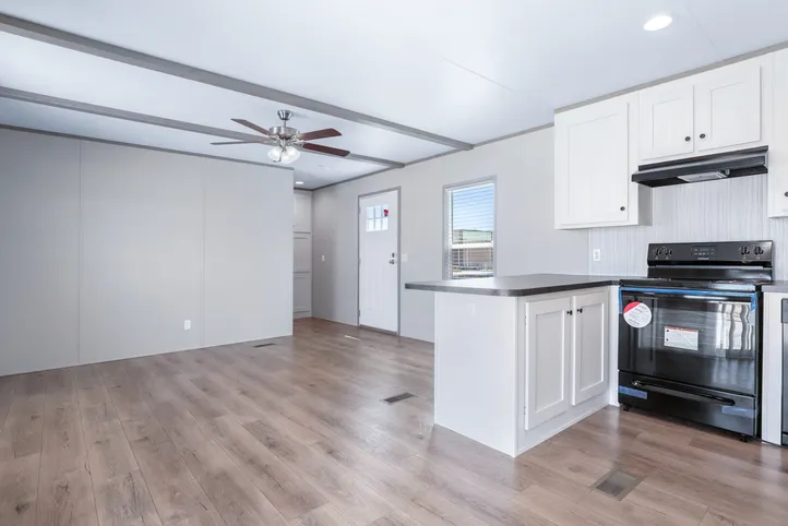 The ANNIVERSARY 16602A Living Room. This Manufactured Mobile Home features 2 bedrooms and 2 baths.