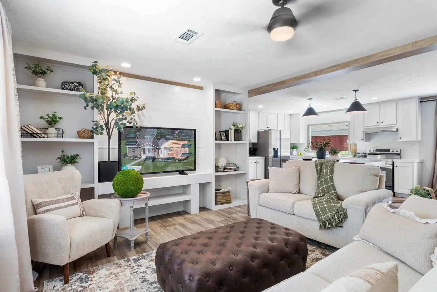 The THE REAL DEAL Living Room. This Manufactured Mobile Home features 3 bedrooms and 2 baths.