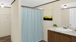 The SATISFACTION Primary Bathroom. This Manufactured Mobile Home features 3 bedrooms and 2 baths.
