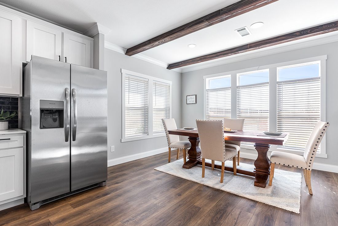 The THE VAIL Dining Room. This Manufactured Mobile Home features 3 bedrooms and 2 baths.