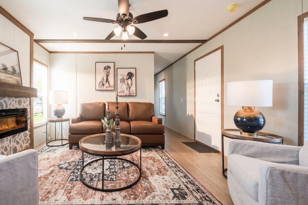 The SEAS THE DAY Living Room. This Manufactured Mobile Home features 3 bedrooms and 2 baths.