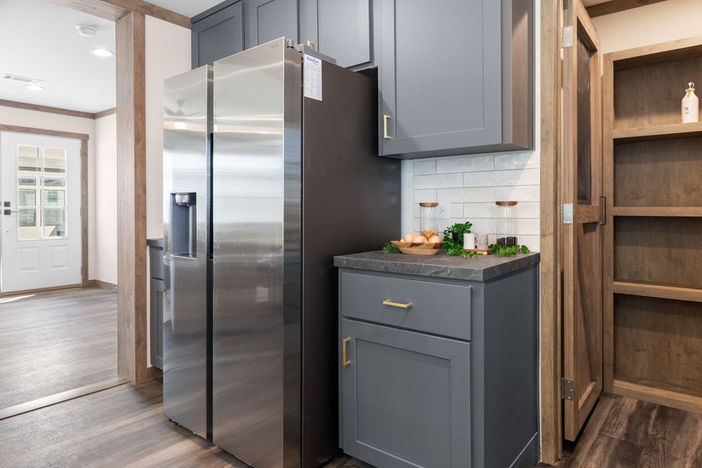 The FARM 4 FLEX Kitchen. This Manufactured Mobile Home features 4 bedrooms and 3 baths.