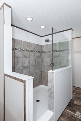 The THE SHOWER HOUSE 2.0 Master Bathroom. This Manufactured Mobile Home features 3 bedrooms and 2 baths.