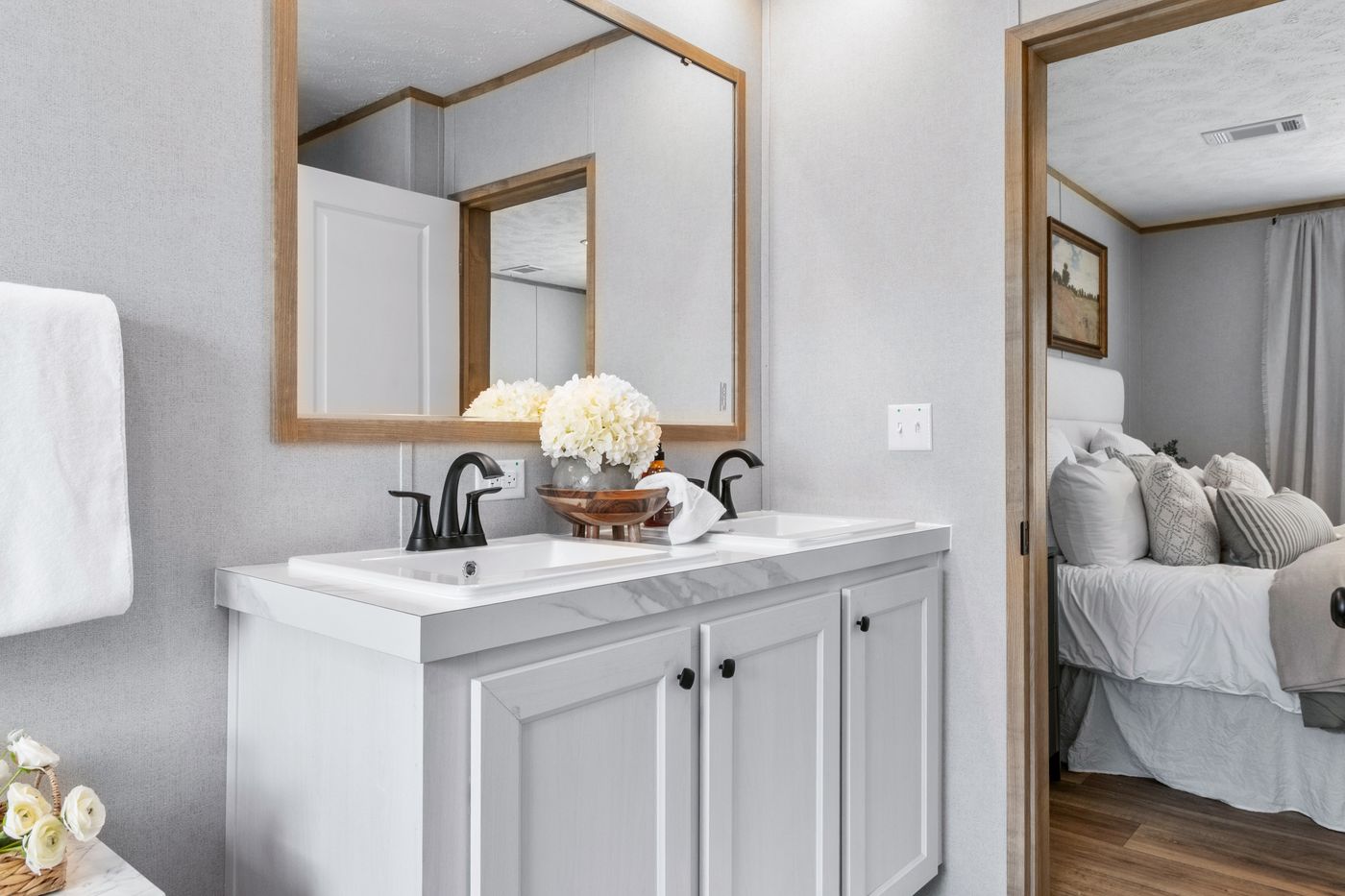 The THE REAL DEAL Primary Bathroom. This Manufactured Mobile Home features 3 bedrooms and 2 baths.