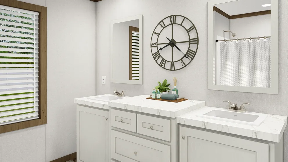 The HOMESTEAD BREEZE Guest Bathroom. This Manufactured Mobile Home features 4 bedrooms and 2 baths.