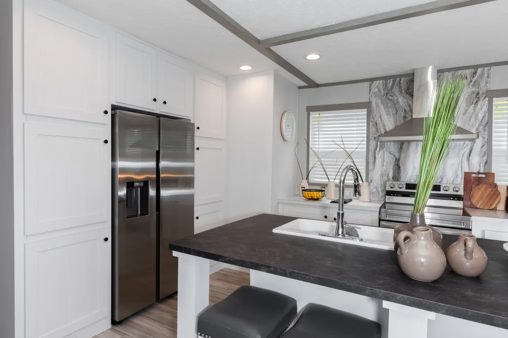 The ANNIVERSARY JEWEL Kitchen. This Manufactured Mobile Home features 3 bedrooms and 2 baths.