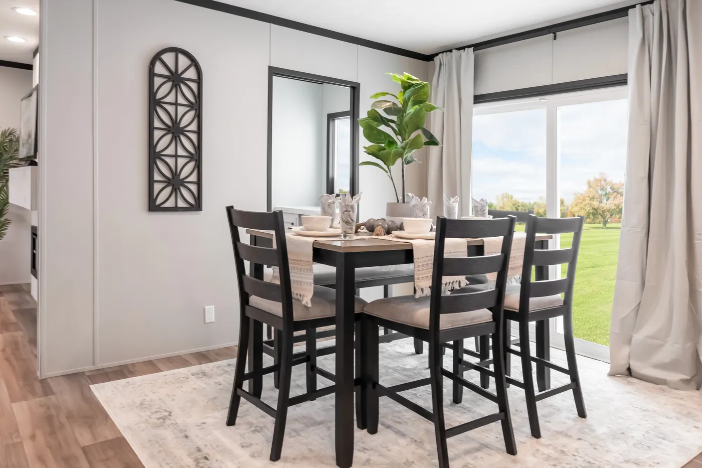 The THE ANNIVERSARY 2.1 Dining Area. This Manufactured Mobile Home features 3 bedrooms and 2 baths.