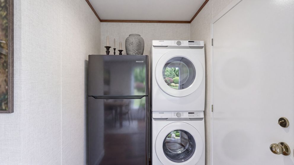 The BUTTERCUP Utility Room. This Manufactured Mobile Home features 1 bedroom and 1 bath.