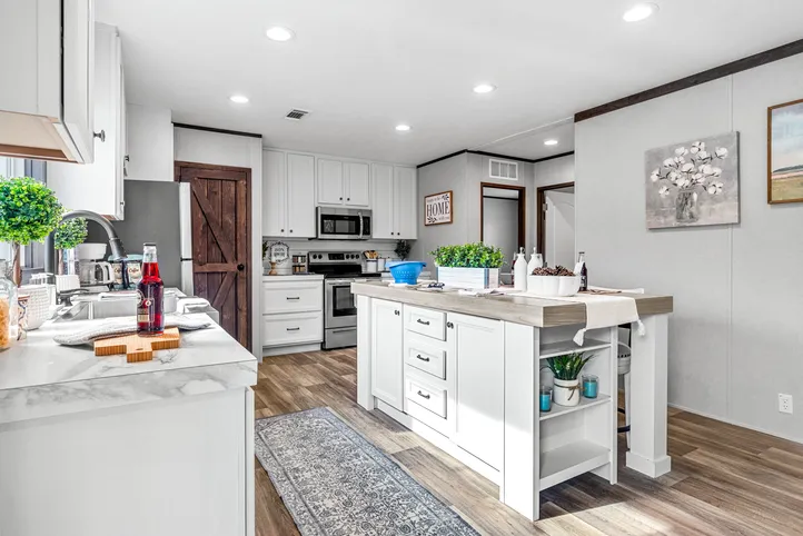 The THE ANNIVERSARY 2.1 Kitchen. This Manufactured Mobile Home features 3 bedrooms and 2 baths.