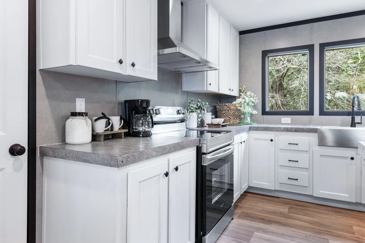 The ABSOLUTE VALUE Kitchen. This Manufactured Mobile Home features 4 bedrooms and 2 baths.