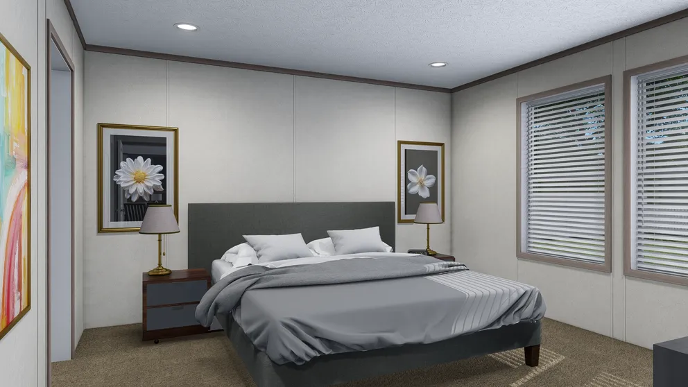 The 6428-E792 THE PULSE Primary Bedroom. This Manufactured Mobile Home features 3 bedrooms and 2.5 baths.