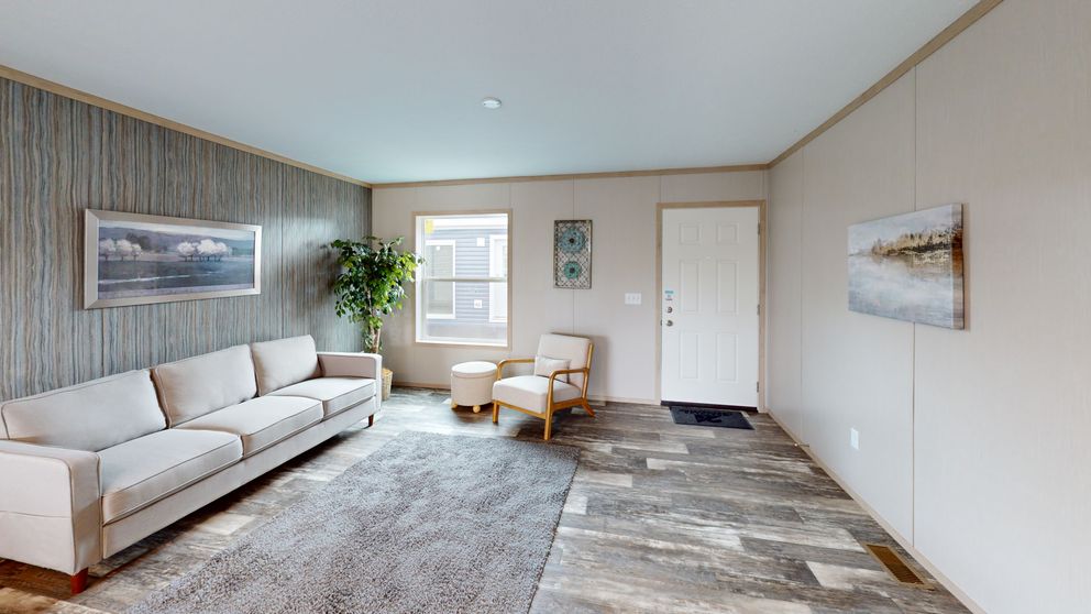 The HANCOCK Living Room. This Manufactured Mobile Home features 4 bedrooms and 2 baths.