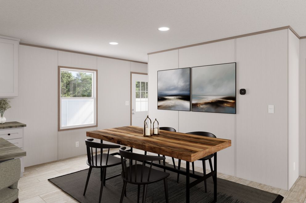 The ULTRA FLEX Dining Area. This Manufactured Mobile Home features 3 bedrooms and 2 baths.