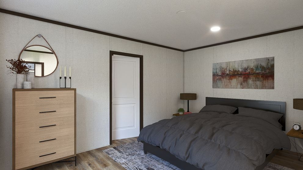 The SPIRIT Primary Bedroom. This Manufactured Mobile Home features 2 bedrooms and 2 baths.