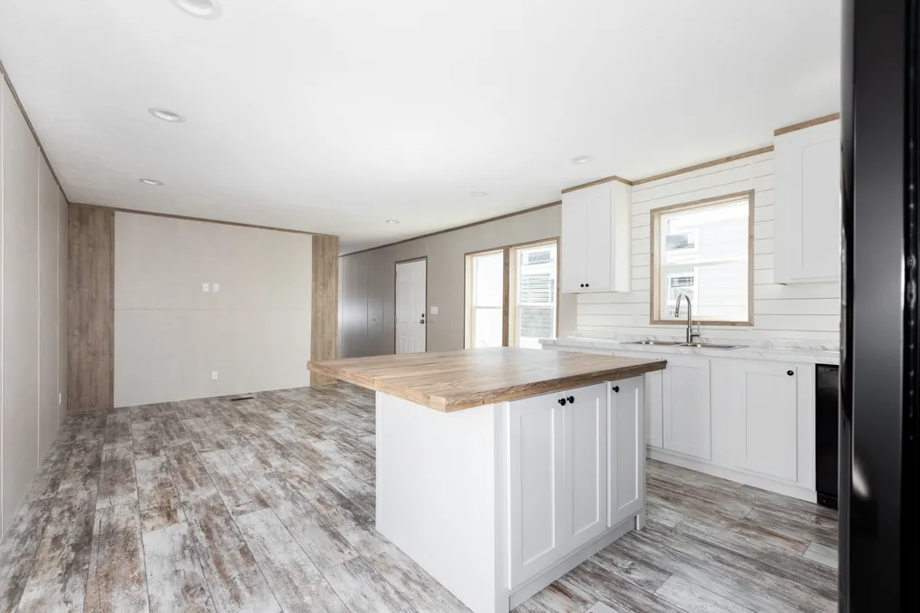 The TRUMAN Living Room. This Manufactured Mobile Home features 4 bedrooms and 2 baths.