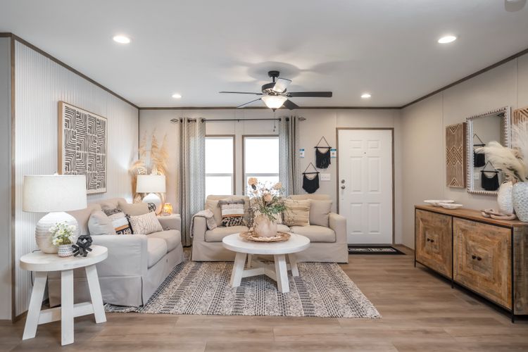 The VISTA Living Room. This Manufactured Mobile Home features 3 bedrooms and 2 baths.