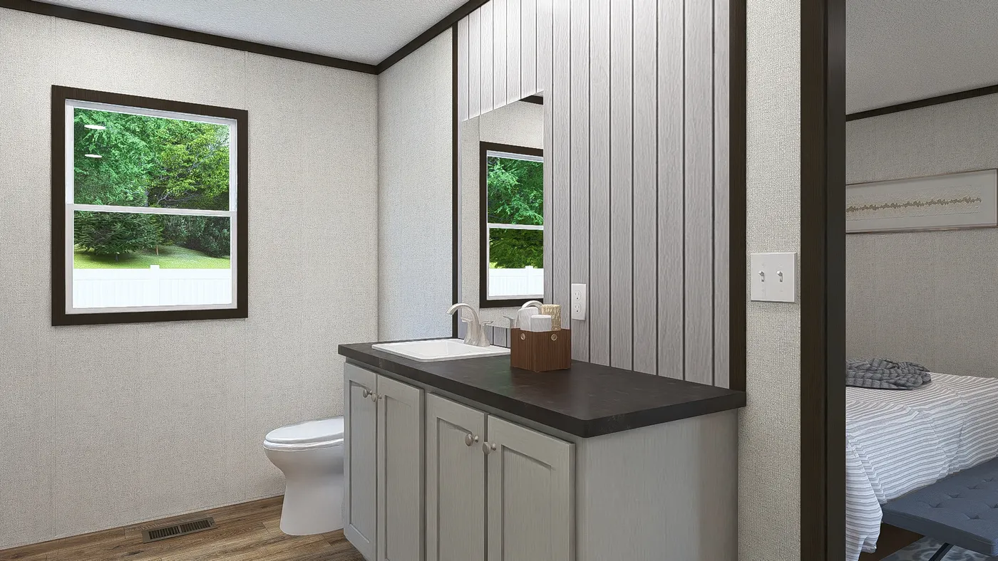 The COLOSSAL Primary Bathroom. This Manufactured Mobile Home features 3 bedrooms and 2 baths.
