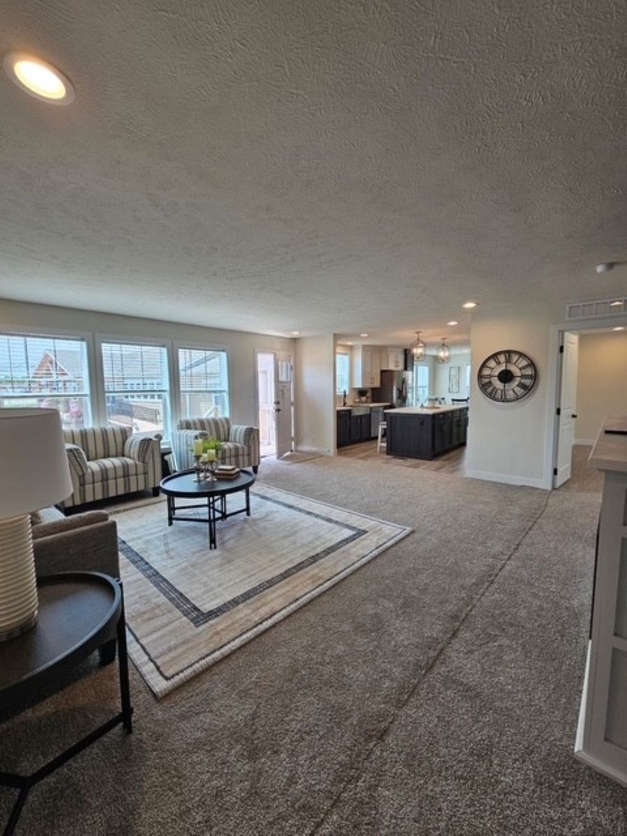 The PIONEER ST 6030-MS064 SECT Living Room. This Manufactured Mobile Home features 3 bedrooms and 2 baths.