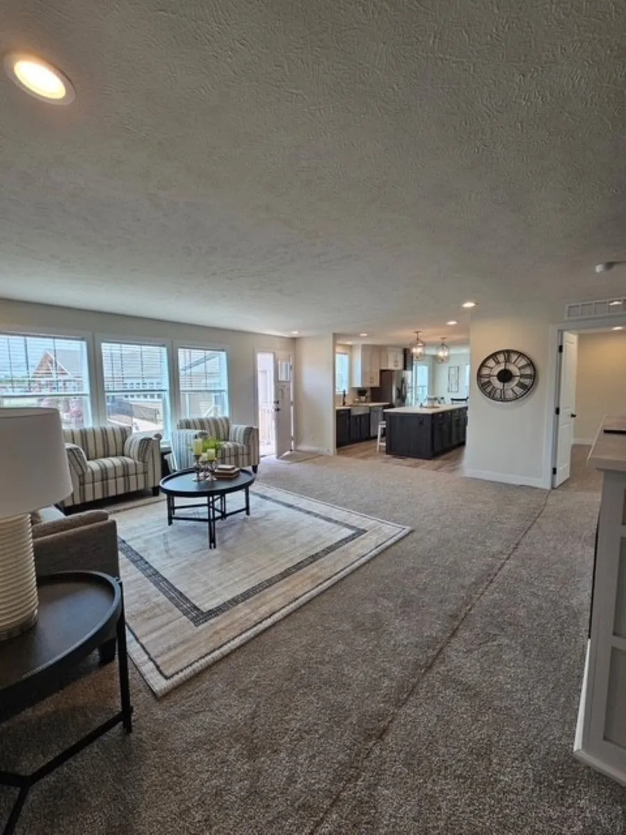 The PIONEER ST 6030-MS064 SECT Living Room. This Manufactured Mobile Home features 3 bedrooms and 2 baths.