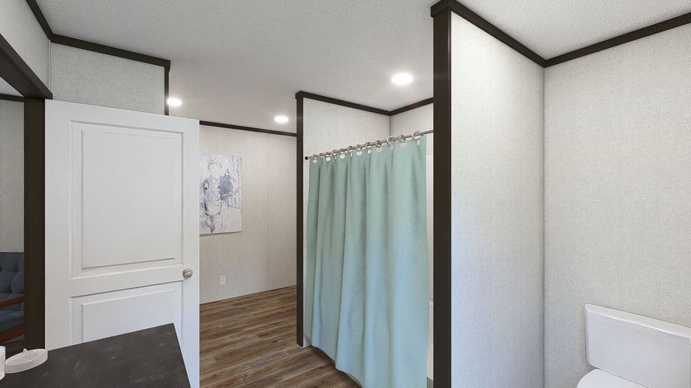 The DYNAMIC Primary Bathroom. This Manufactured Mobile Home features 3 bedrooms and 2 baths.