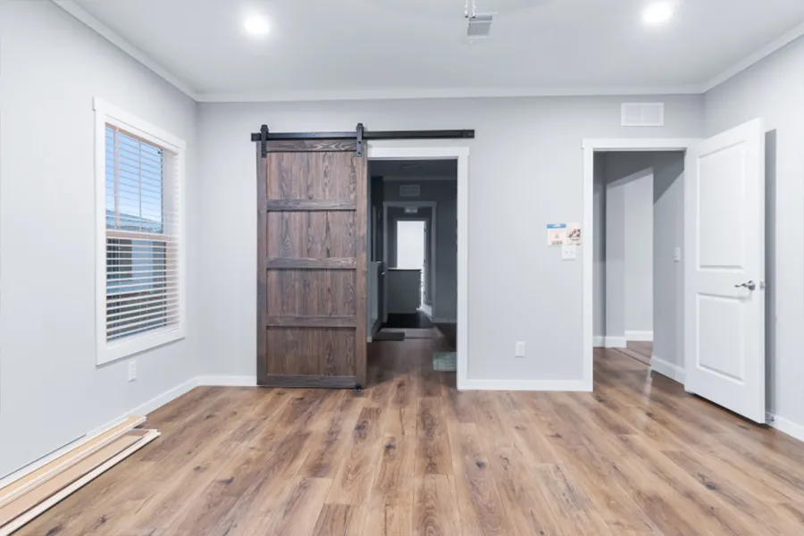 The THE OLYMPUS Primary Bathroom. This Manufactured Mobile Home features 4 bedrooms and 3 baths.