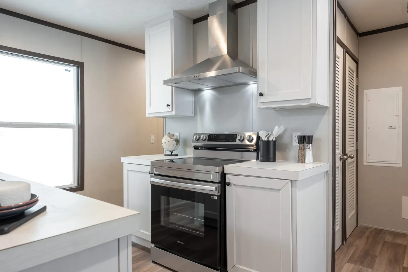 The ESSENCE Kitchen. This Manufactured Mobile Home features 3 bedrooms and 2 baths.