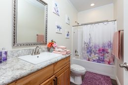The SUM3076A Guest Bathroom. This Manufactured Mobile Home features 4 bedrooms and 2.5 baths.