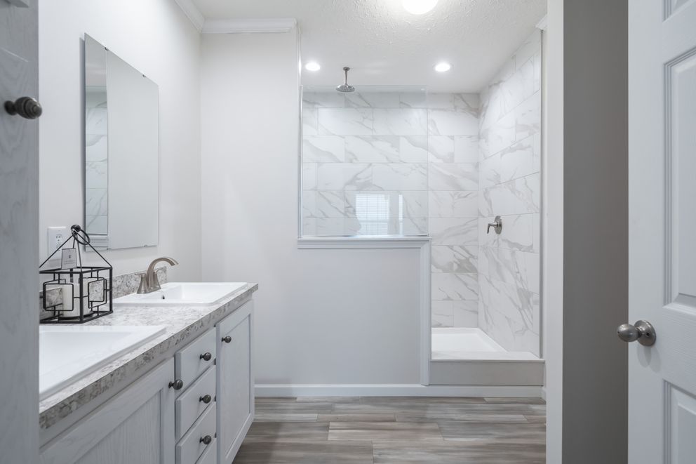 The 3542 HUD 56X28 CAVALIER SELECT Primary Bathroom. This Manufactured Mobile Home features 3 bedrooms and 2 baths.