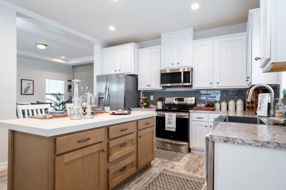 The 2889 THE COTTAGE HUD Kitchen. This Manufactured Mobile Home features 3 bedrooms and 2 baths.