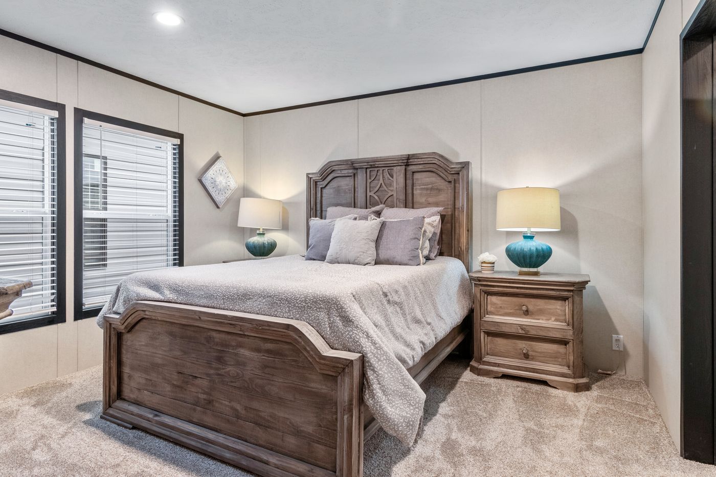 The THE RENEGADE Primary Bedroom. This Manufactured Mobile Home features 3 bedrooms and 2 baths.