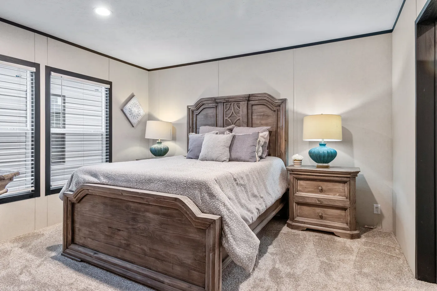 The THE RENEGADE Primary Bedroom. This Manufactured Mobile Home features 3 bedrooms and 2 baths.
