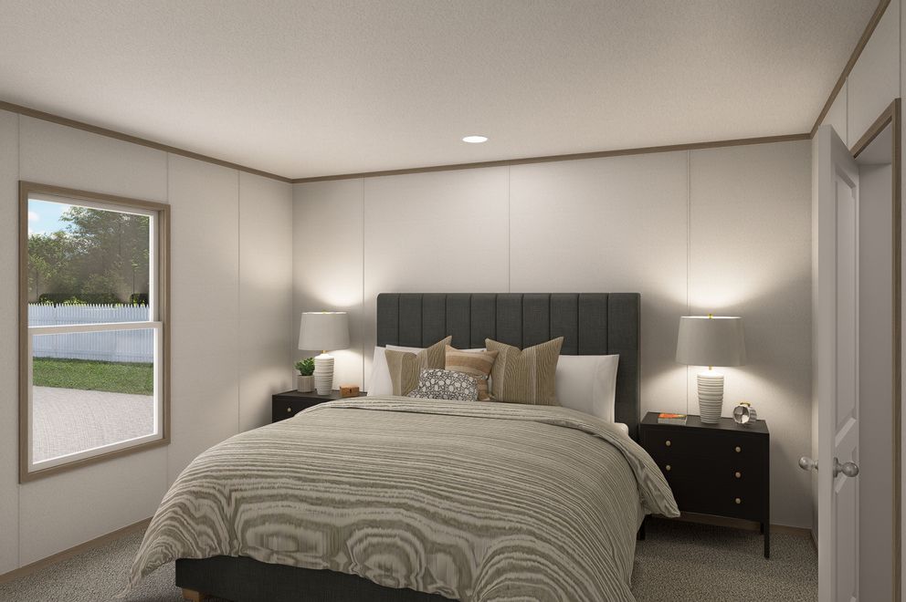 The THE EAGLE 48 Primary Bedroom. This Manufactured Mobile Home features 3 bedrooms and 2 baths.
