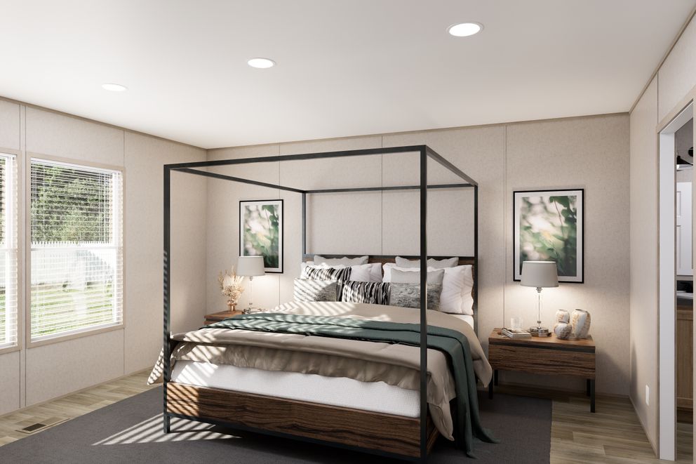 The TRADITION 3260 Primary Bedroom. This Manufactured Mobile Home features 3 bedrooms and 2 baths.