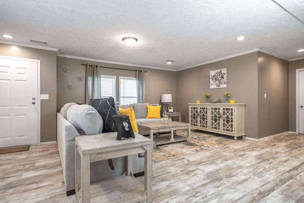 The CASCADE Living Room. This Manufactured Mobile Home features 4 bedrooms and 2 baths.