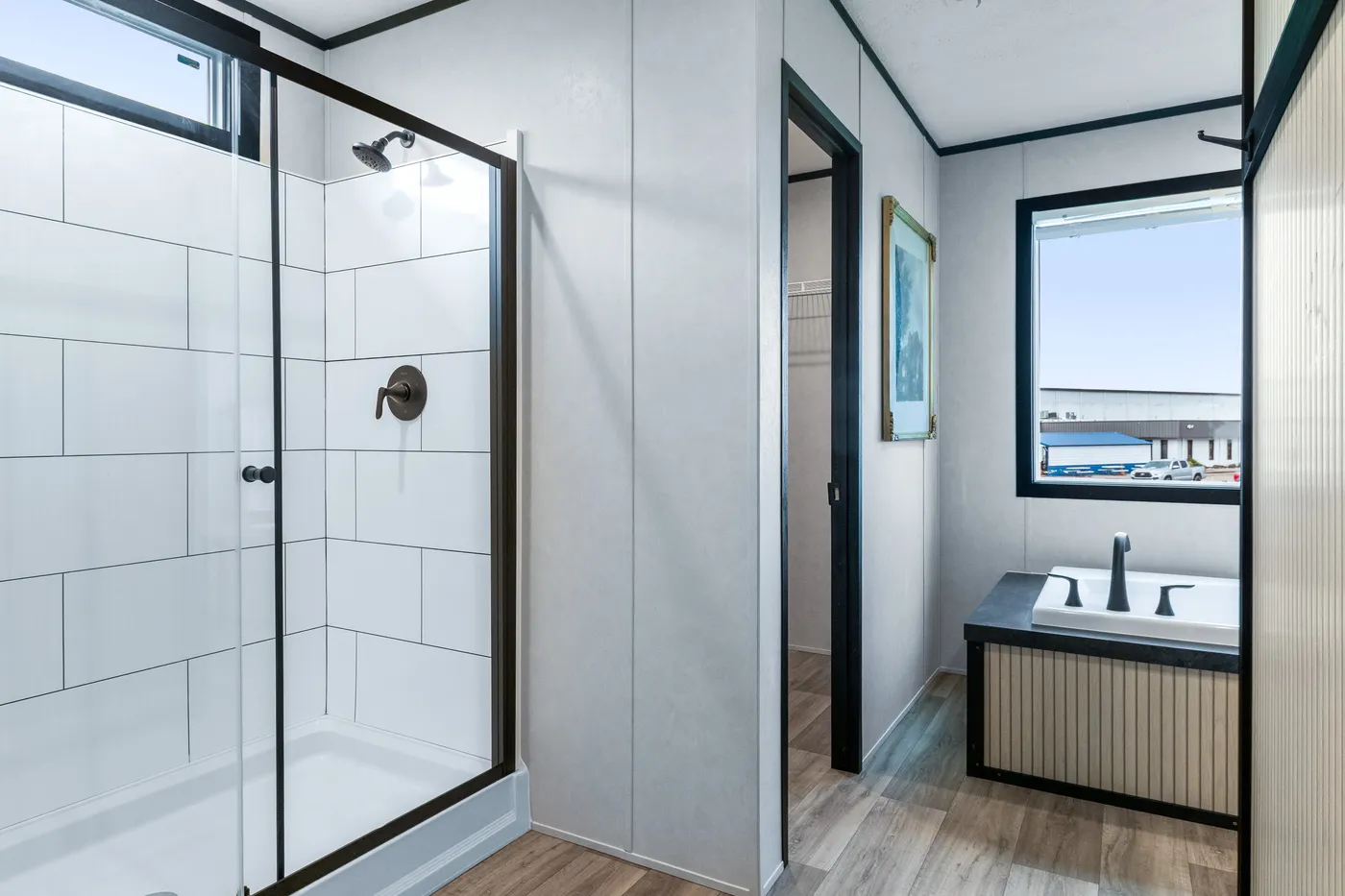 The ODYSSEY Primary Bathroom. This Manufactured Mobile Home features 4 bedrooms and 2 baths.