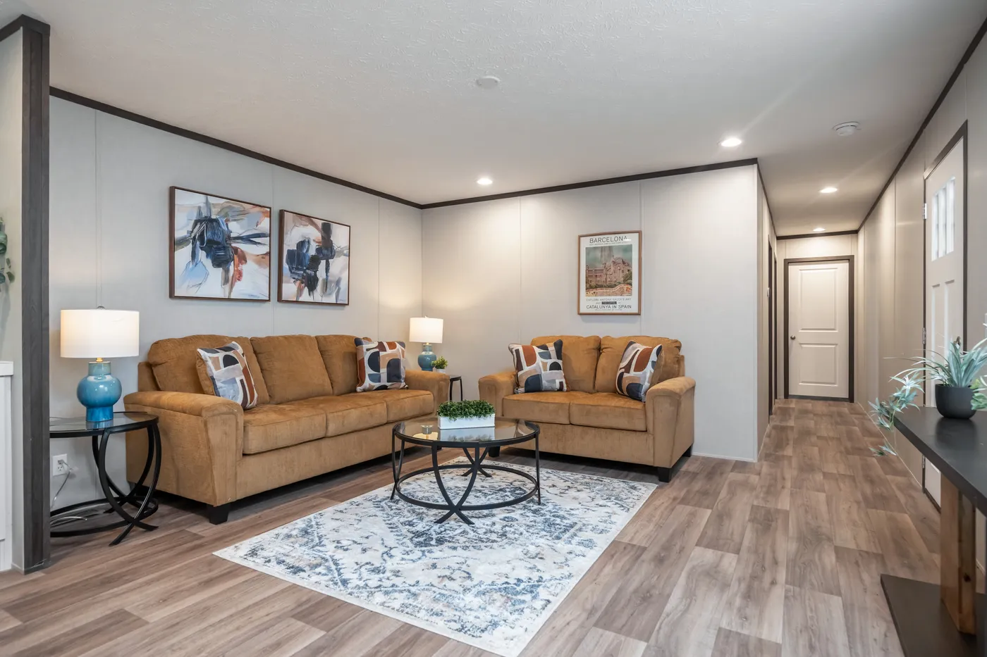 The ESSENCE Living Room. This Manufactured Mobile Home features 3 bedrooms and 2 baths.